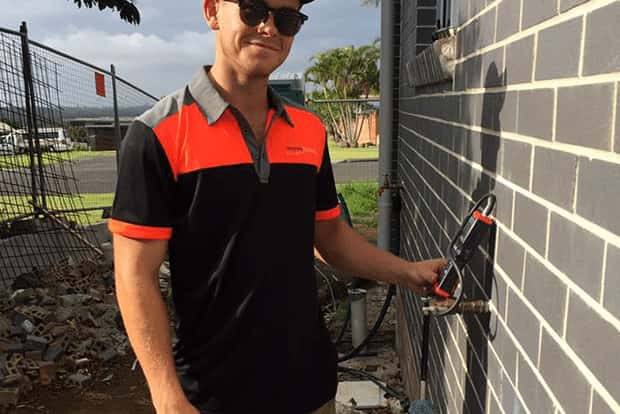 plumber fixing emergency plumbing problem - Ballina